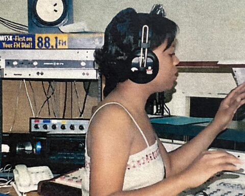 Archival photo of a broadcaster at an HBCU radio station console